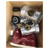 Box of miscellaneous items including sport mugs