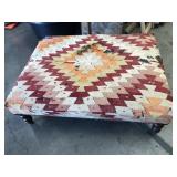 Rug upholstered ottoman