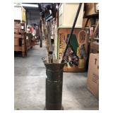 Brass umbrella stand with walking sticks