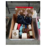 Box of vintage perfumes and handbag