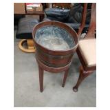 Antique wooden bowl on stand with tin liner
