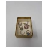 Box of colorful sterling rings