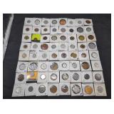 Collection of 64 vintage tokens in holders