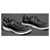 Tennis shoes marked Hoka One, size unmarked