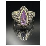 Sterling silver ring with faceted purple stone
