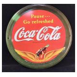 1999 Coca-Cola metal sign 12"diam