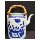 Vintage Chinese porcelain tea pot in basket