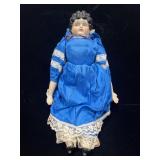Vintage doll with porcelain face, arms and feet