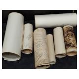 Group of rolled up vintage group photos