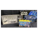 Model kits including Star Wars, police car, ship