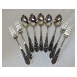 Nine pieces antique .800 Silver flatware. 400