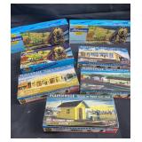 Miniature trains, scale buildings in bot lot