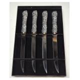 Set of four grape motif steak knives in box