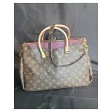 Designer style purse marked L V , we don