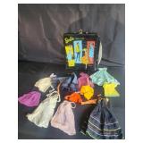 Group of doll clothes , vintage Barbie doll case