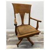 Antique wooden circa 1910 rolling desk chair