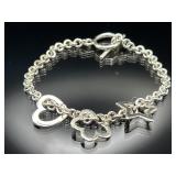 Sterling silver heart, star & flower charm