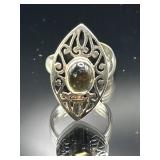 Sterling silver ornate ring with center stone,