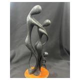Wood sculpture of family