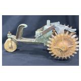 Vintage cast iron walking water sprinkler