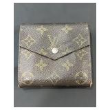 Designer style wallet marked Louis Vuitton