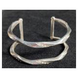 Jewelry: silver bracelet, initialed.