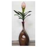 Large ceramic vase with artificial plant