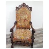 Antique carved throne chair upholstered with