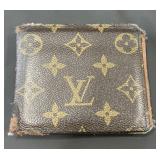 Designer style wallet marked Louis Vuitton