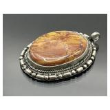 Silver wrapped gemstone pendant, 2" l.