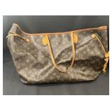 Designer style handbag marked Louis Vuitton