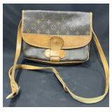 Designer style handbag marked Louis Vuitton
