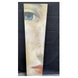 Painting on board of the face of a lady 51" x 12"