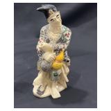 Vintage Asian figurine marked by maker