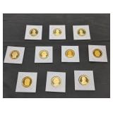Ten proof US Presidential Dollar coins in holders