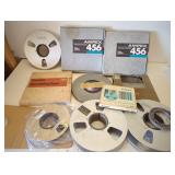 Box of vintage studio mastering tape and reels.