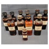 Antique group of brown glass apothecary bottles