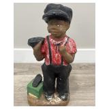 Vintage cement shoe shiner statue