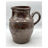 Signed, ceramic pottery pitcher, 9" h.