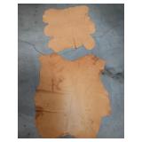 Pair of tan leather pieces