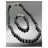 Pair of vintage sterling silver clasp black beaded