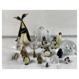 Group of penguin figurines some glass,