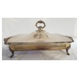 Ornate white metal serving dish with pyrex