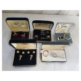 3 tuxedo sets and 2 key rings. Display case.