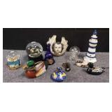 Group of ceramic bell, snow globe, duck bank,