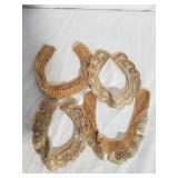 4 collar sequenced pieces. Display case.