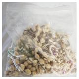 Miscellaneous shelled necklaces. Display case.