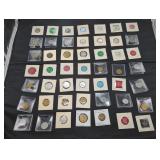 Collection of vintage tokens and medals in holders