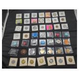 Collection of vintage medals and tokens in holders