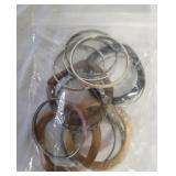 Miscellaneous bracelets. 14 ct. display case.